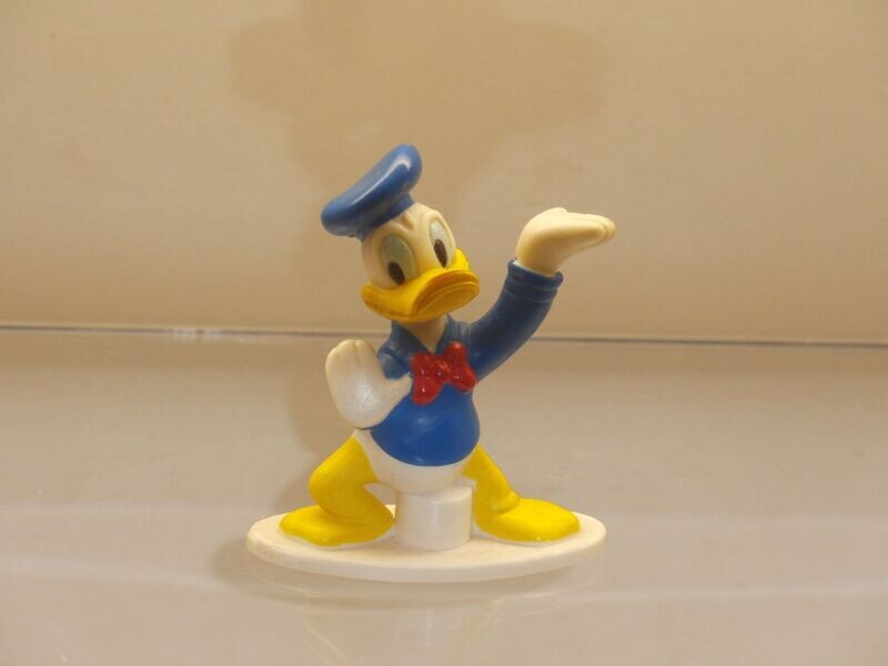 Disney Donald Duck: Nestle: 90er Jahre: Donald, linke Hand gehoben Disney Donald Duck: Nestle: 90er Jahre: Donald, linke Hand gehoben