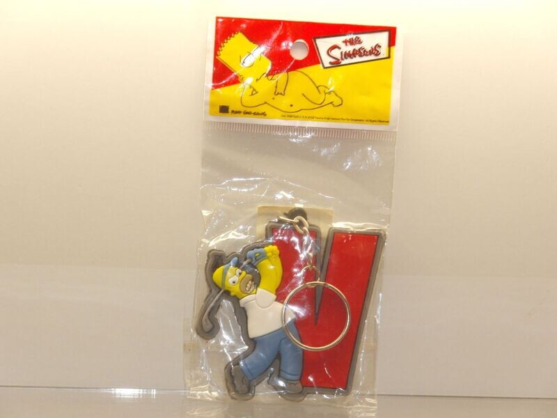 The Simpsons: Homer mit Golfschläger als Schlüsselanhänger in Verpackung The Simpsons: Homer mit Golfschläger als Schlüsselanhänger in Verpackung