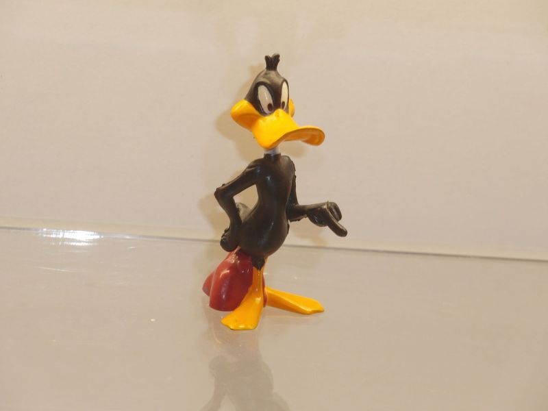 Bugs Bunny & Co.: 90er Jahre: Daffy Duck, zeigend Bugs Bunny & Co.: 90er Jahre: Daffy Duck, zeigend