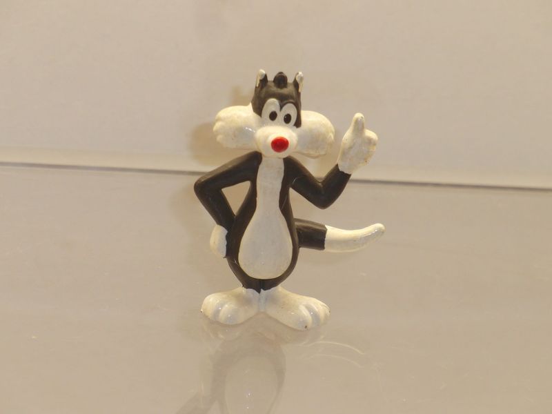 Bugs Bunny & Co.: 90er Jahre: Sylvester linke Hand gehoben Bugs Bunny & Co.: 90er Jahre: Sylvester linke Hand gehoben