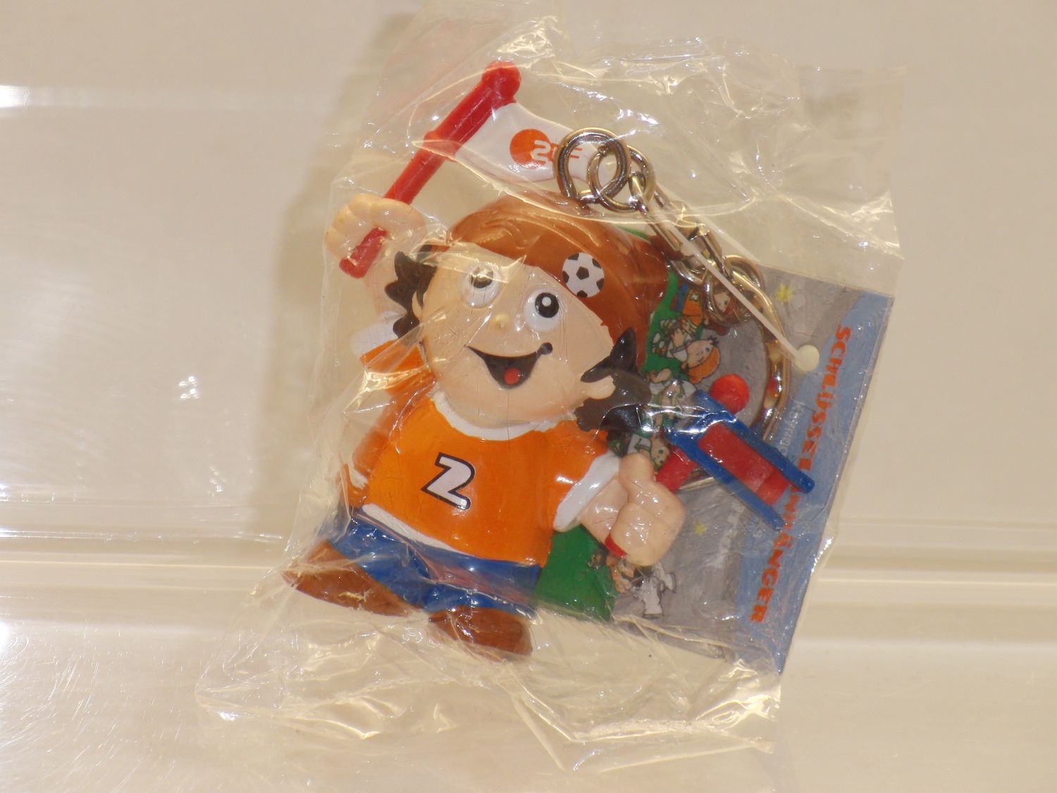 Werbefiguren: ZDF: Mainzelmännchen: P:os 2006: Mainzel Fußballer: Mainzelmännchen als Fan,noch org. verpackt (Schlüsselanhänger)