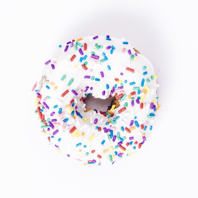 White Iced Sprinkled Yeast Doughnut