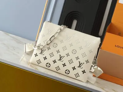 LV white mono coussin