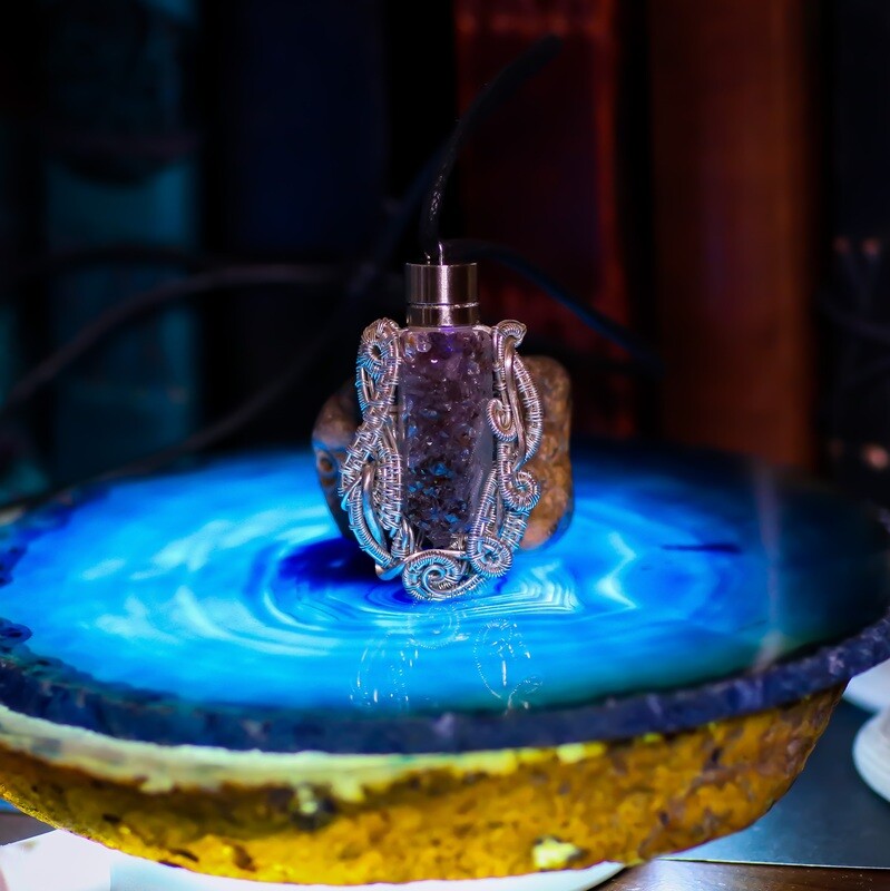 Stunning Sterling Wrapped Amethyst FireFly with a Blue Glow
