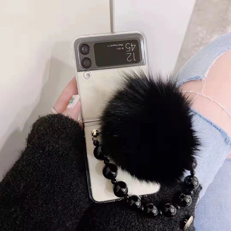 Cover con correa y bolita de peluche