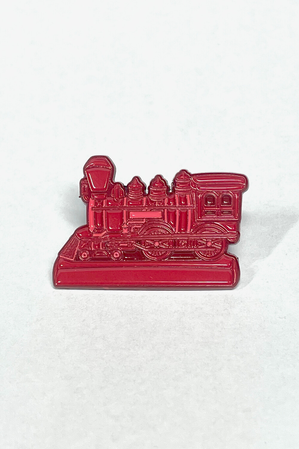 Front of Mold-A-Rama Train Engine Soft Enamel Pin