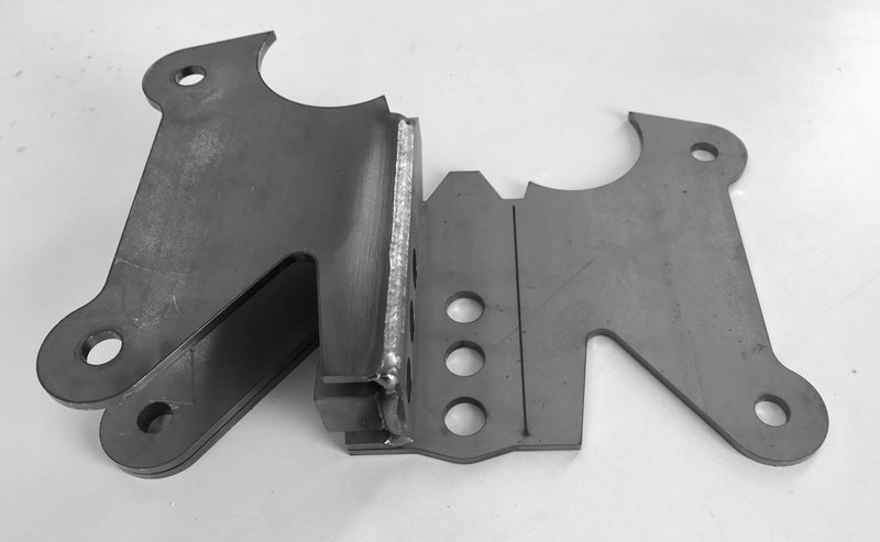 Folded/welded bracket on top of flat bracket.