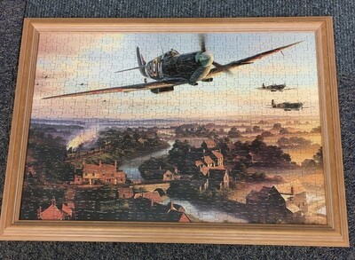 Spitfire in flight - Contains puzzle that can be reassembled and replaced back in frame
