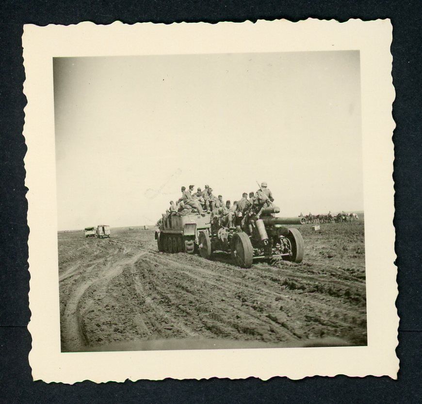 FACEBOOK AUCTION - German WW2 Photo SDKFZ Halftrack Tows Heavy Artillery Through Eastern Front Mud As Many Soldiers Hitch A Ride!