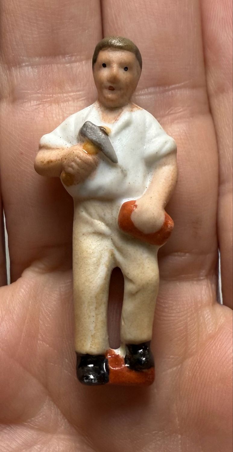German Third Reich WHW Porcelain Figure Pin of Brick Mason with Brick and Walling Hammer