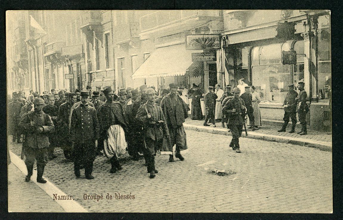 German WW1 Postcard - French &amp; Belgian Soldier Prisoners of War Marched Through Streets of Namur Belgium Under German Guard