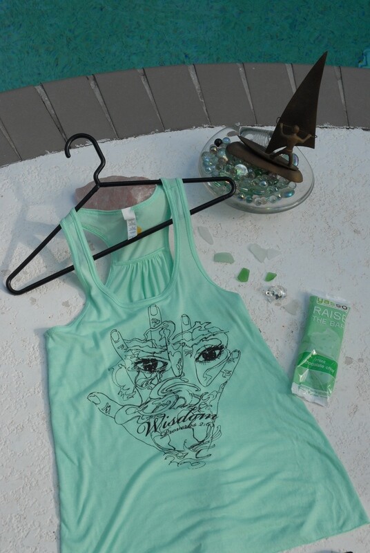 Woman's flowy t back tank with wisdom hand art in black on mint