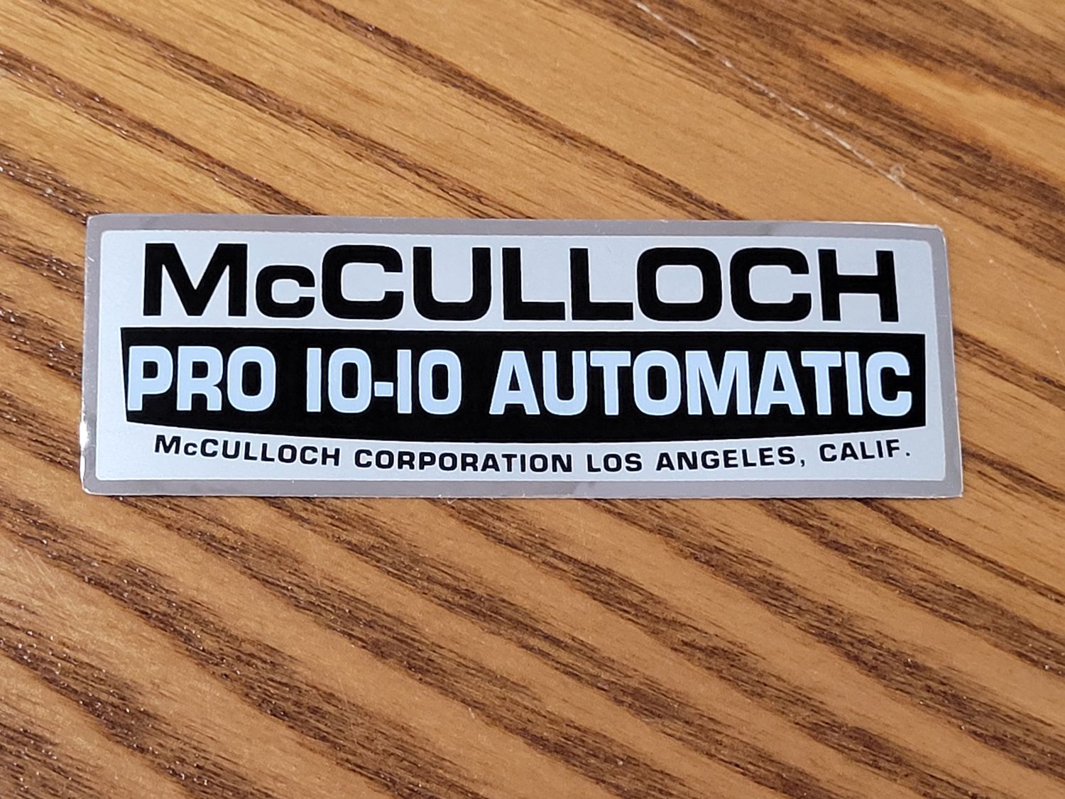 Pro 10-10 Automatic Silver, Black, and White filter cover sticker
