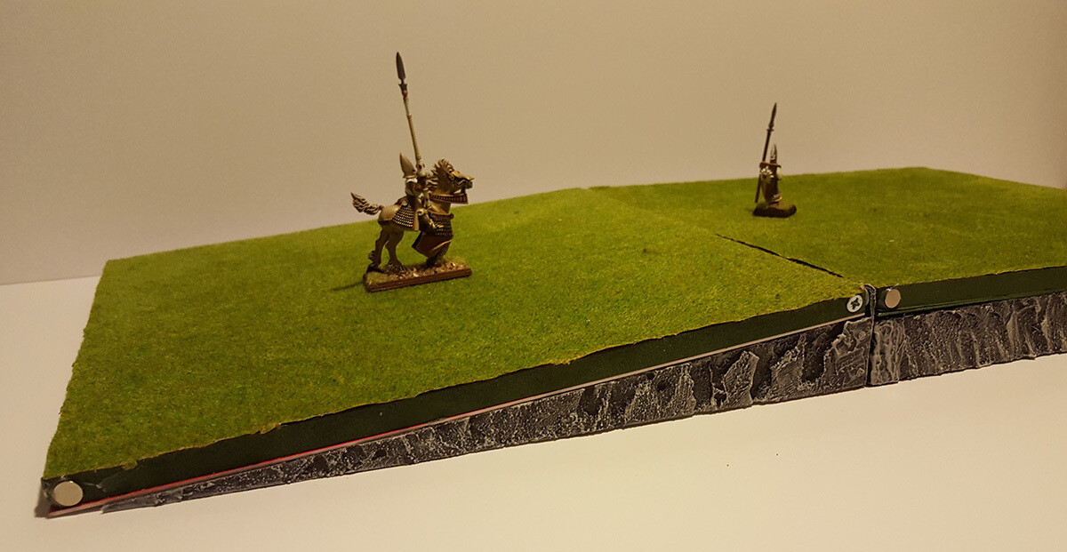 Slope and Raised Supports creating a hilltop with plain tiles, with gentle slope so minis do not slide (tiles and miniatures not included)