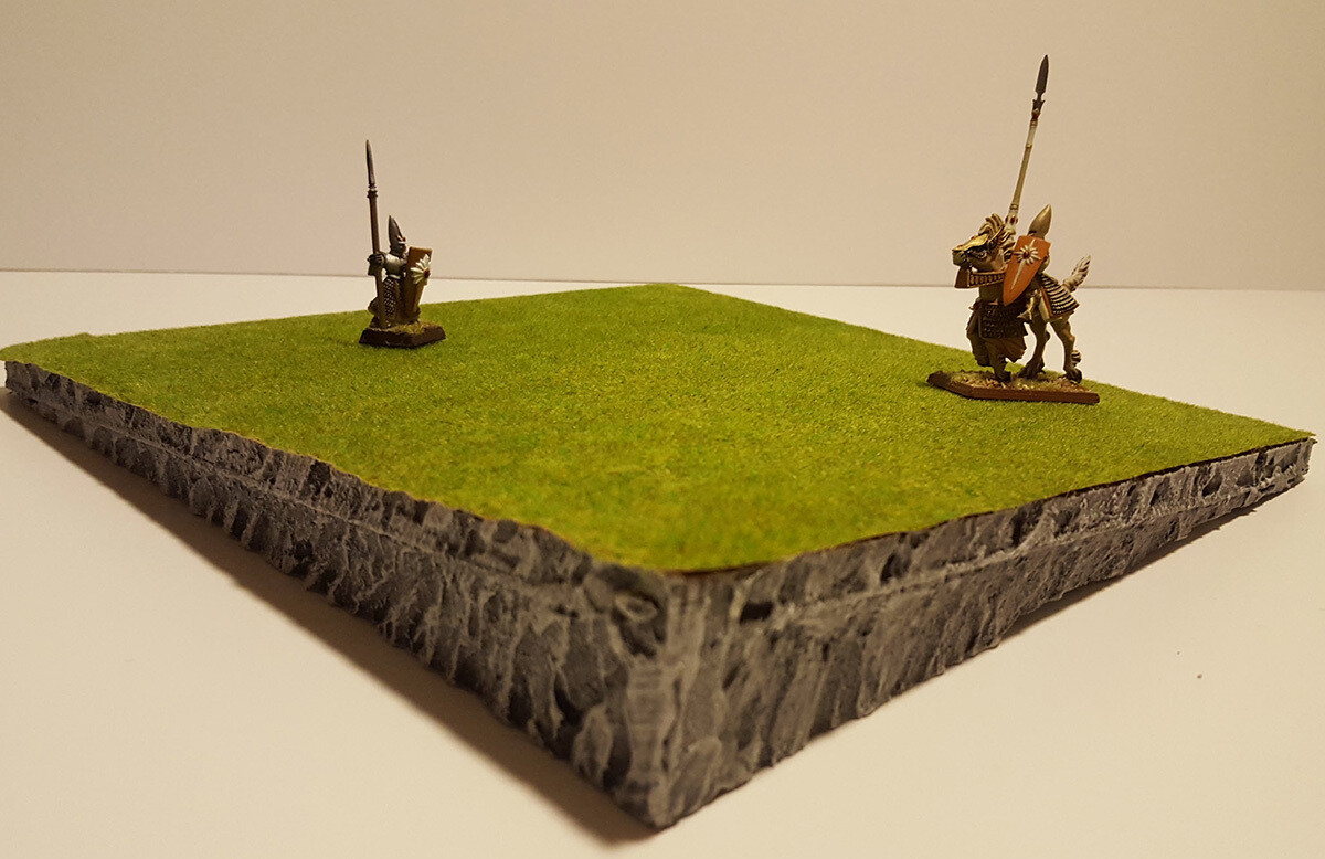 the tile forms two gentle, non-sliping slopes up to +3cm height (miniatures not included)