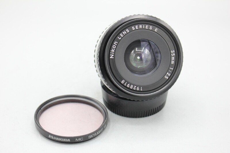 NIKON 35MM 1:2.5 E LENS, CLAD FULLY WORKING