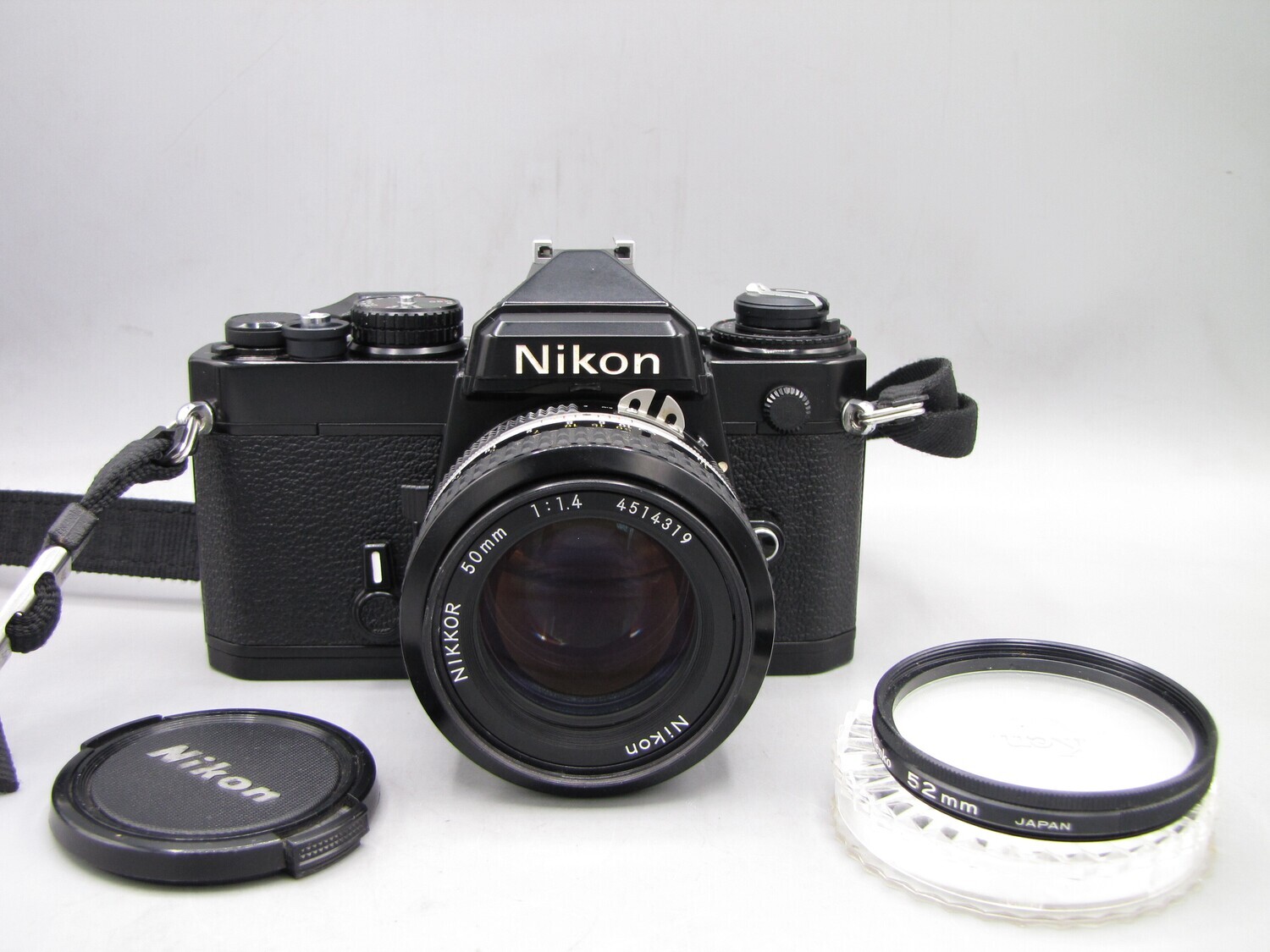 Nikon FE 35mm SLR Camera w 1.4/50 Clad Seals Battery Tested