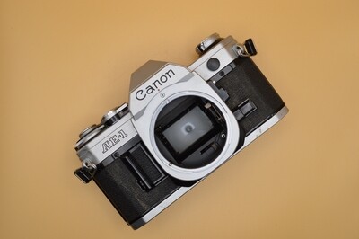 Canon AE-1 SLR 35mm camera body for parts or repairs