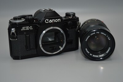 Vintage Canon AE1 SLR 35mm Film Camera body with Canon FD 135mm 1:3.5