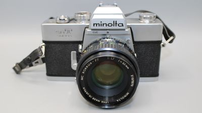 Minolta SRT101 35MM SLR CAMERA W 50MM LENS CLAD TESTED