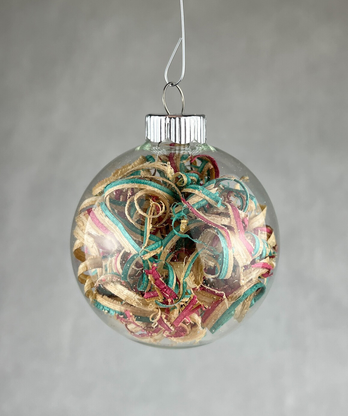 Small Glass Ornament with Various Wood & Skateboard Shavings