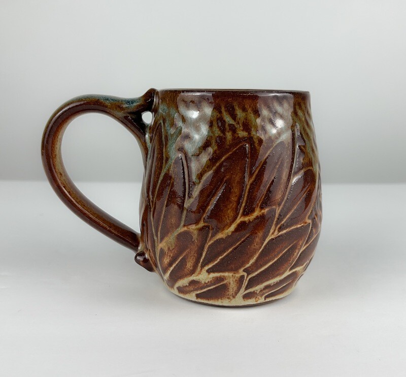 Carved Brown/ Teal Medium Pottery Mugs by Elsa Valinas Available at Handworks Gallery, Saint John New Brunswick