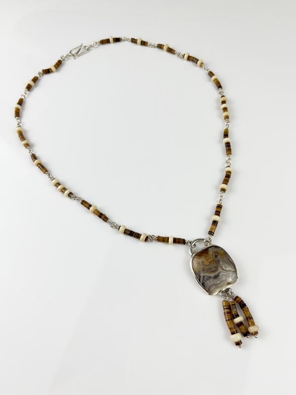 Crazy Lace Agate Pendant on Bone Shell Heishi Necklace