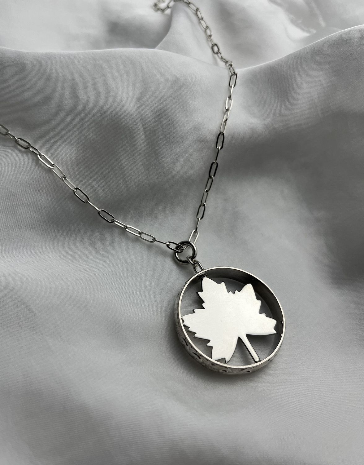 Maple Leaf in Textured Circle Pendant Sterling Silver