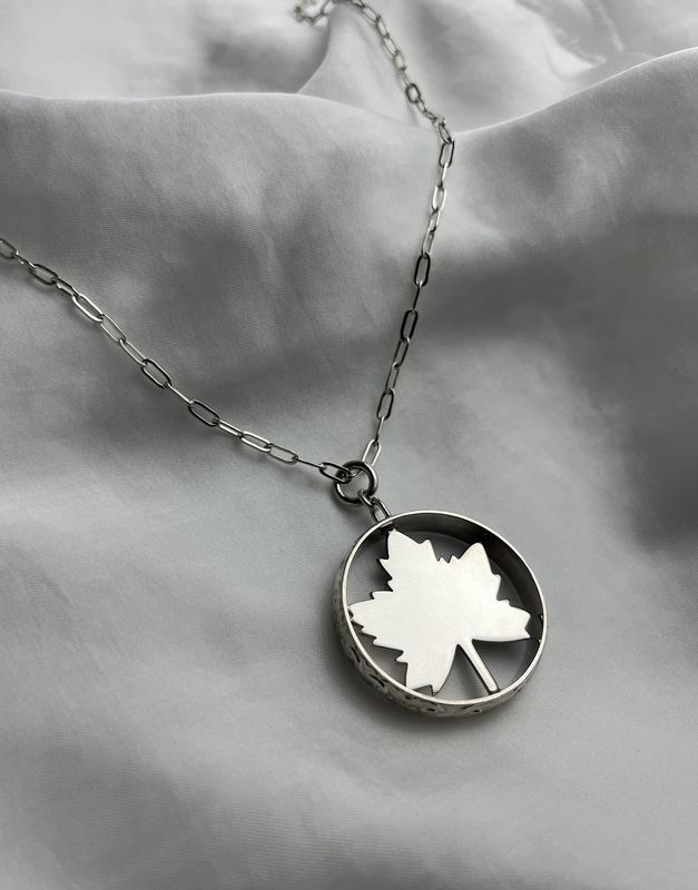 Maple Leaf in Textured Circle Pendant Sterling Silver