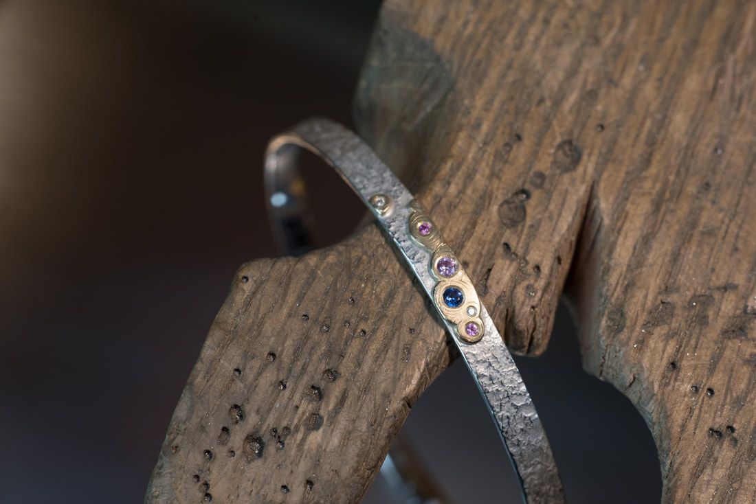 Wide Bangle Medium: Sterling Silver, 18K Gold, 4 Sapphires, 2 Diamonds