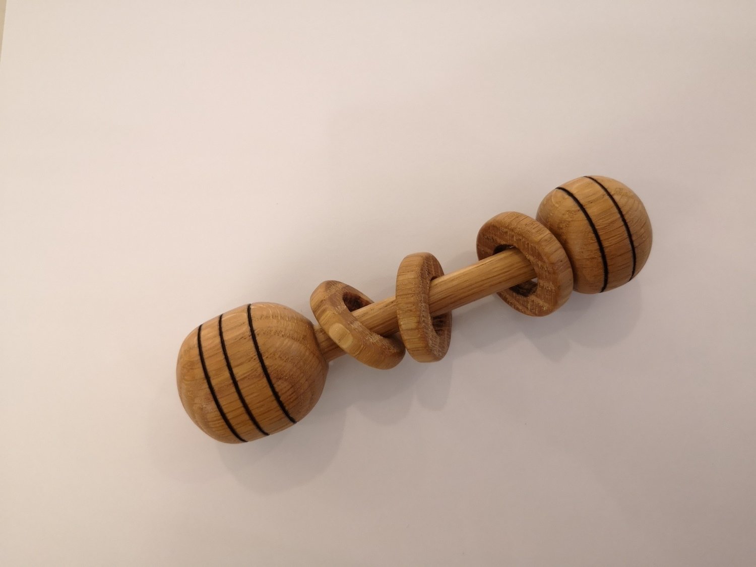 Baby Rattles made of one piece of wood, coated with miner oil