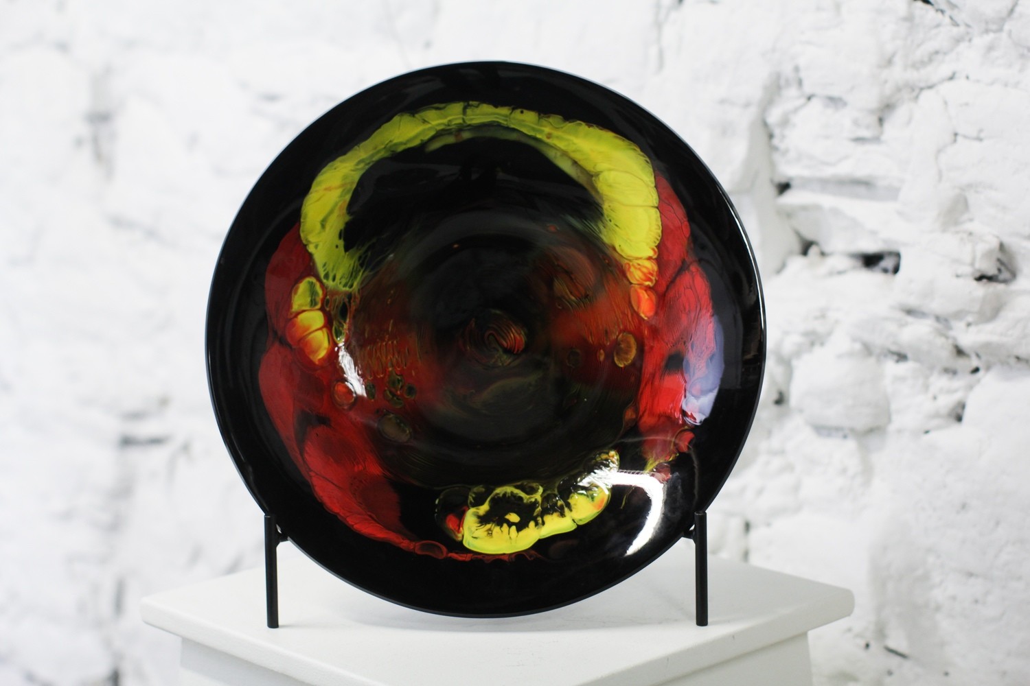 Red, yellow, and black bowl on vertical stand, 14.5