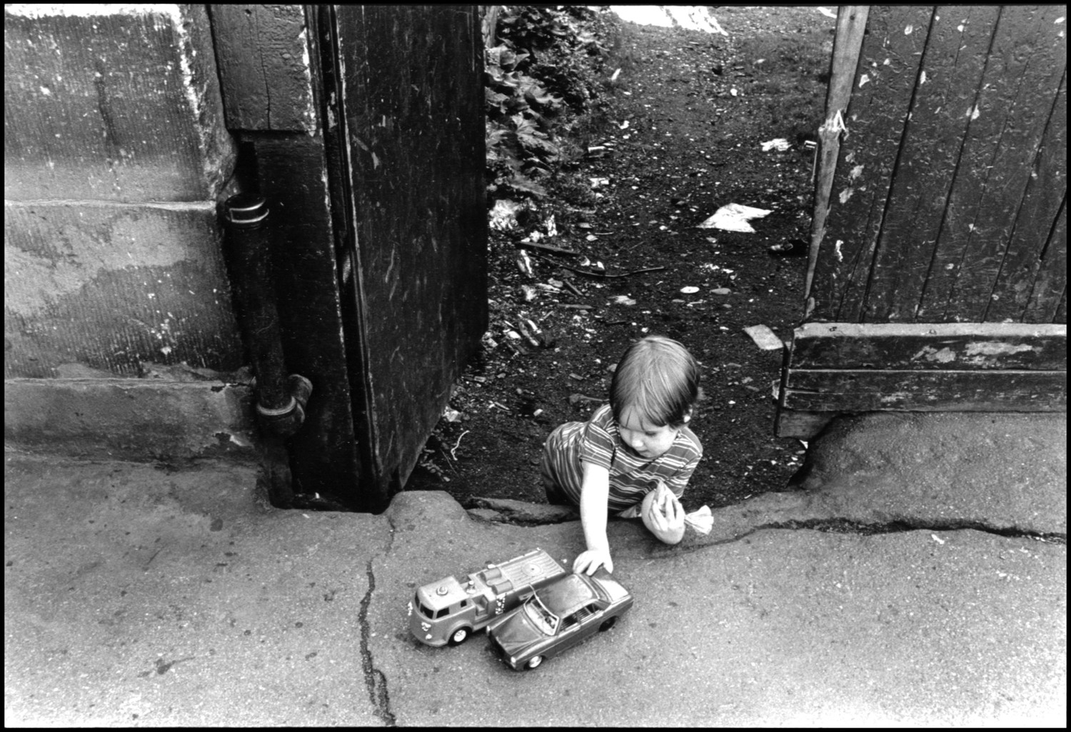 Boy with Toy Cars, South End B&W Photograph (Not Framed)