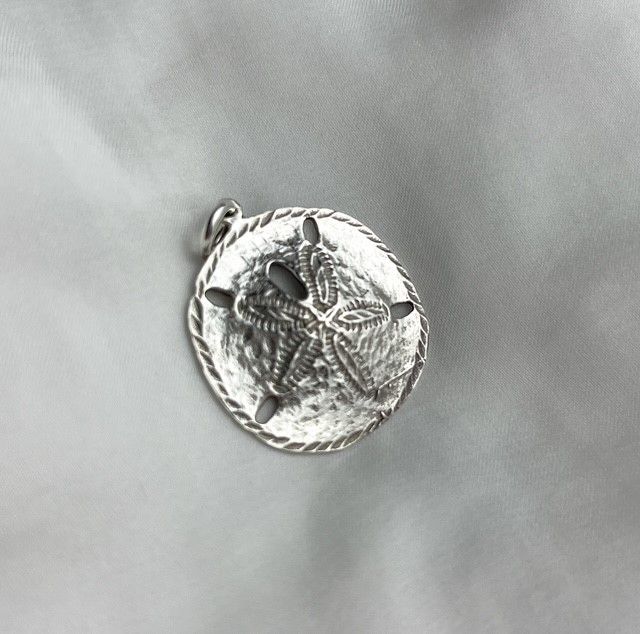 Trudy Gallagher Handworks Gallery Saint John New Brunswick Canada Jeweler Metalsmith Handmade Silver Sand Dollar Charm