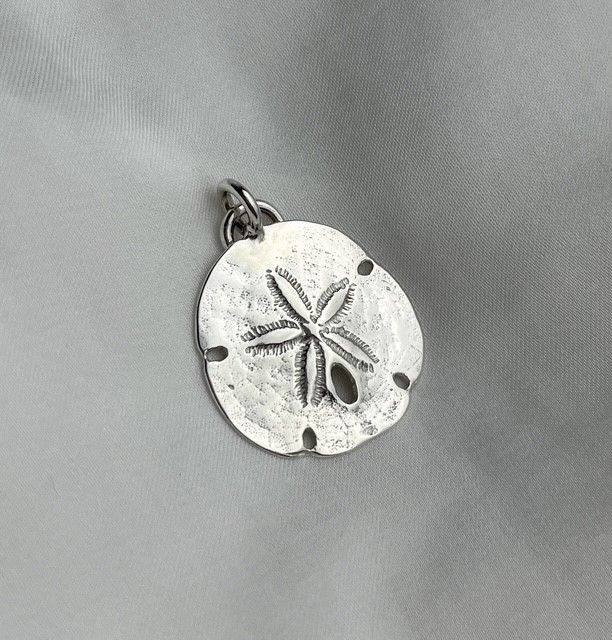 Trudy Gallagher Handworks Gallery Saint John New Brunswick Canada Jeweler Metalsmith Handmade Silver Sand Dollar Charm