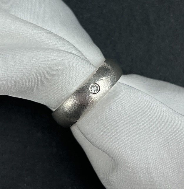 Textured 6mm Band Flush Set with an Antique Cut 2.3mm Natural Diamond Size 10
