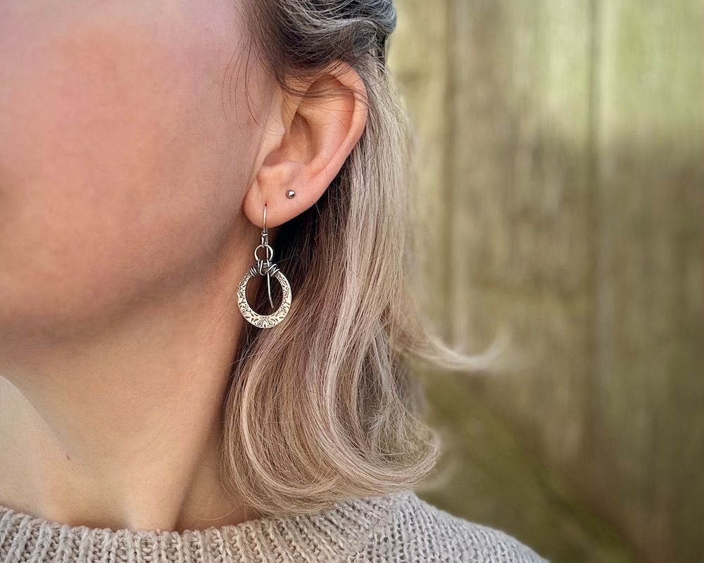 Silver Cut-Out Oval Textured Drop Earrings