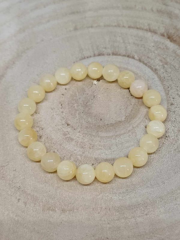 CALCITE ORANGE A  ​bracelet élastique, perles 08mm, dimension 17cm