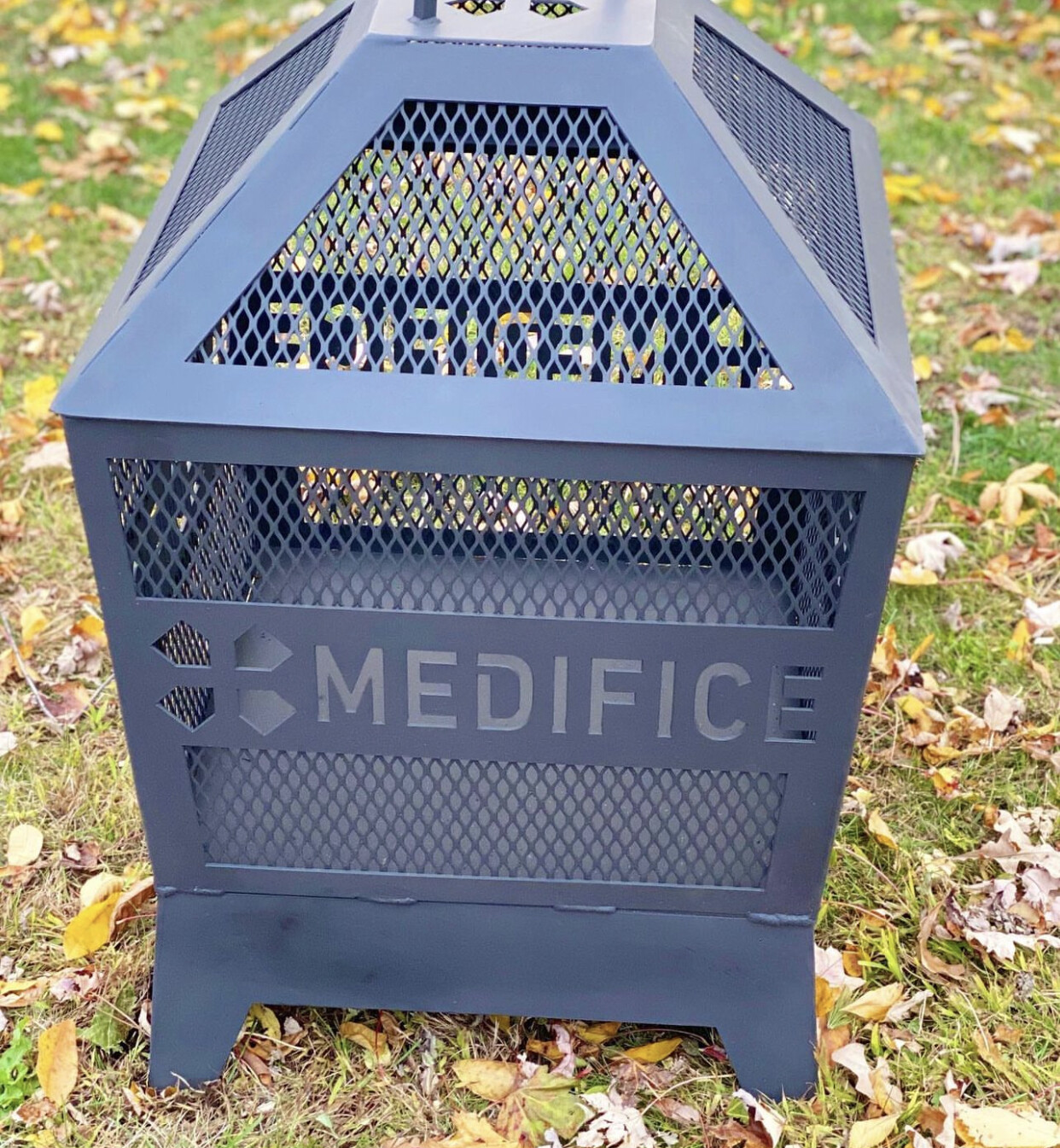 Caged fire pit
