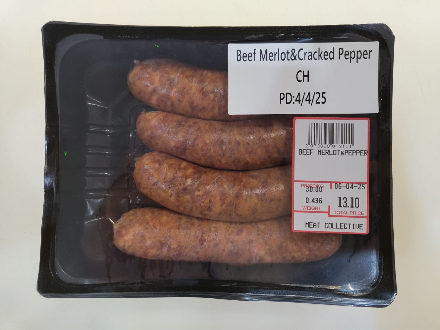 BEEF MERLOT &amp; CRACKED PEPPER SAUSAGE - $3.00 PER 100 GMS