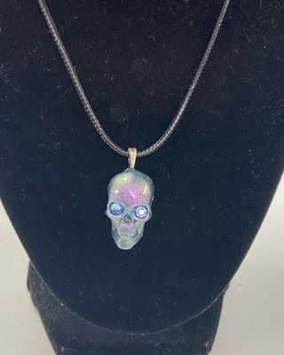 Resin skull pendant with cord