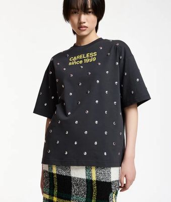 T-shirt Essentiel en coton noir avec slogan jaune