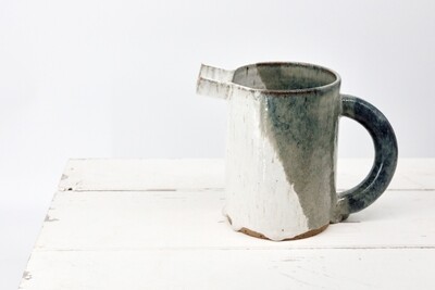 Jug - Flecked white with mottled blue/green. Jug - Flecked white with mottled blue/green.