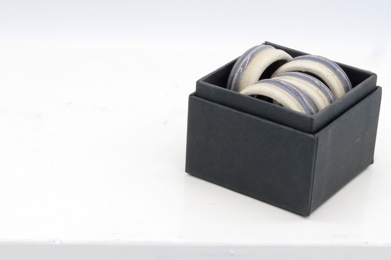Napkin rings - set of 4 grey napkin rings in a gift box.