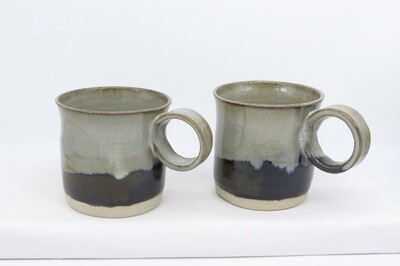 Mug with round handle - Black and mottled grey. Mug with round handle - Black and mottled grey.