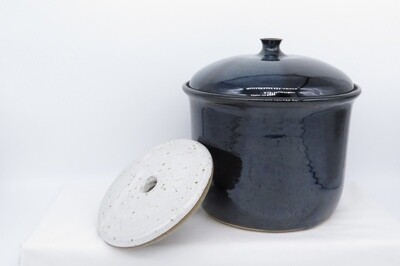 Large water sealed fermentation jar with weight.