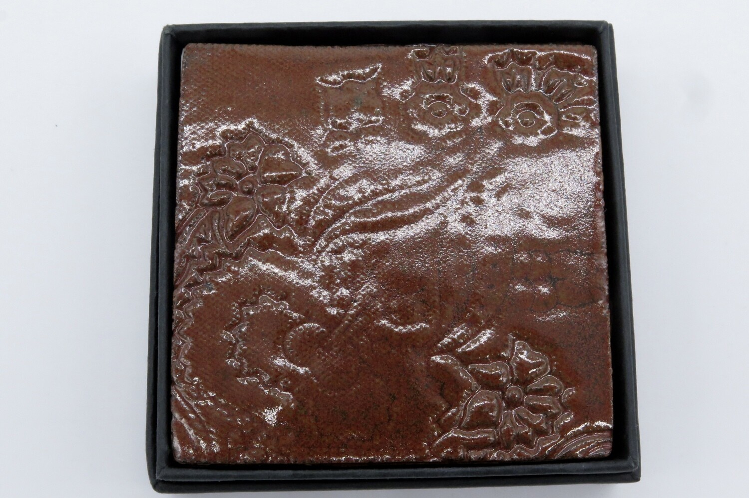 Coasters: set of 4 square coasters in brick red.