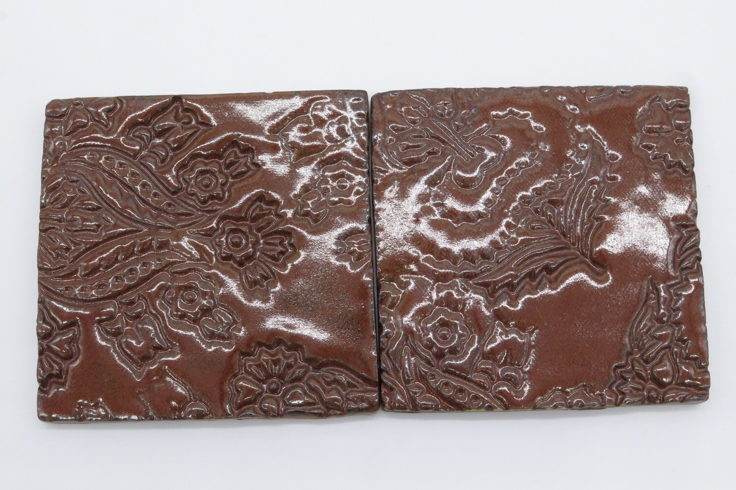 Coasters: set of 4 square coasters in brick red.