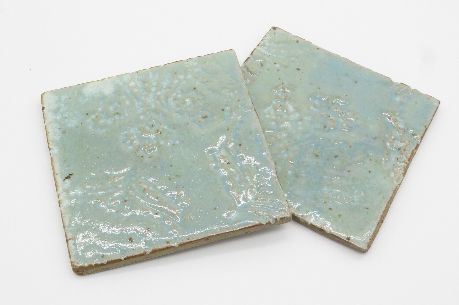 Coasters: set of 2 coasters in celadon green.