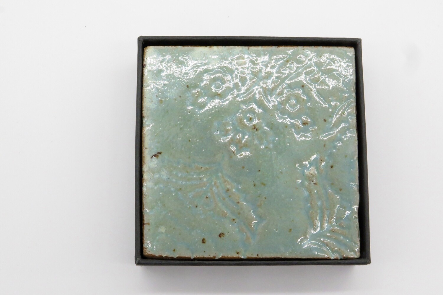 Coasters: set of 2 coasters in celadon green.